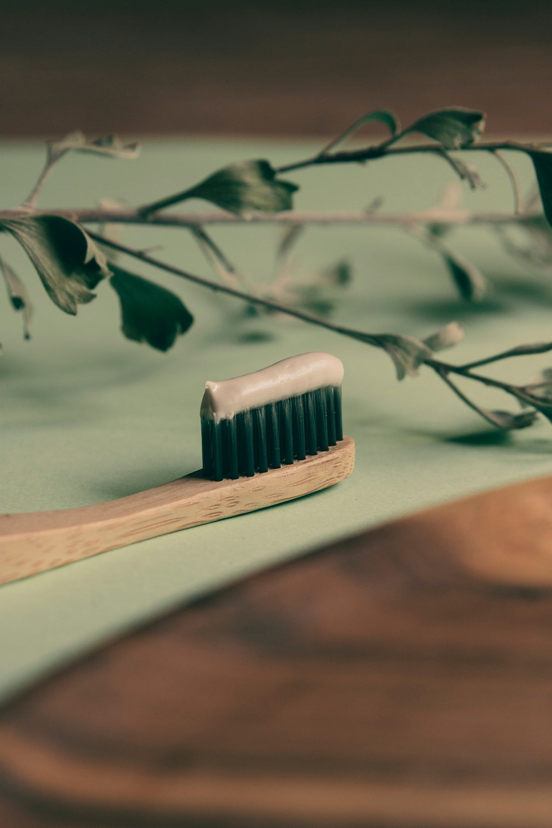 brown wooden brush on white table